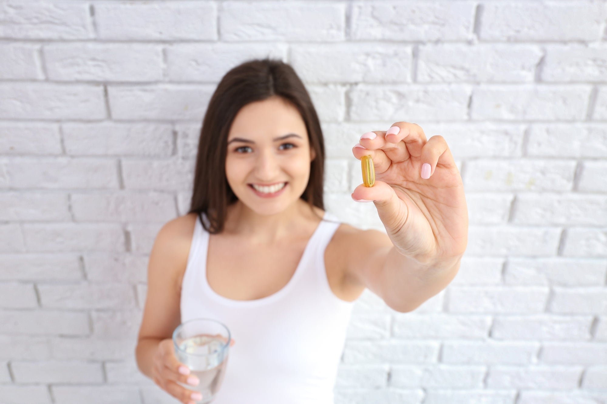 Prenatal DHA and Why It’s Critical, young woman holding supplementaPrenatal DHA and Why It’s Critical, young woman holding supplement, What is DHA? DHA and the Brain